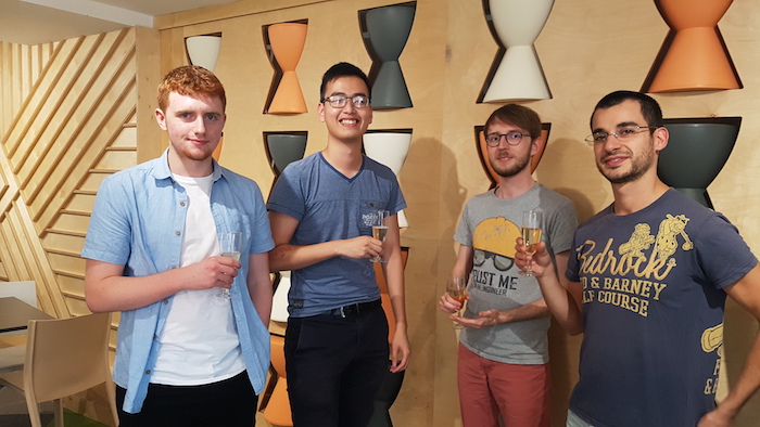 Enjoying a glass of champagne with fellow interns as we celebrate August birthdays in the company. From left to right: Toby, Oscar, Augustin and me.