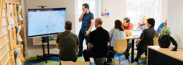 A team at Cambridge Intelligence working together to solve a data visualization challenge