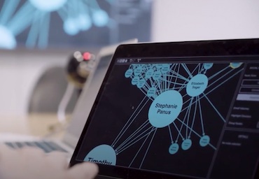 A laptop displaying a ReGraph network graph visualization