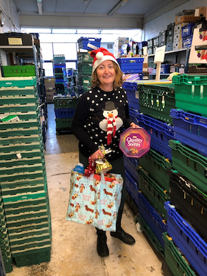 Foodbank staff member collecting donations