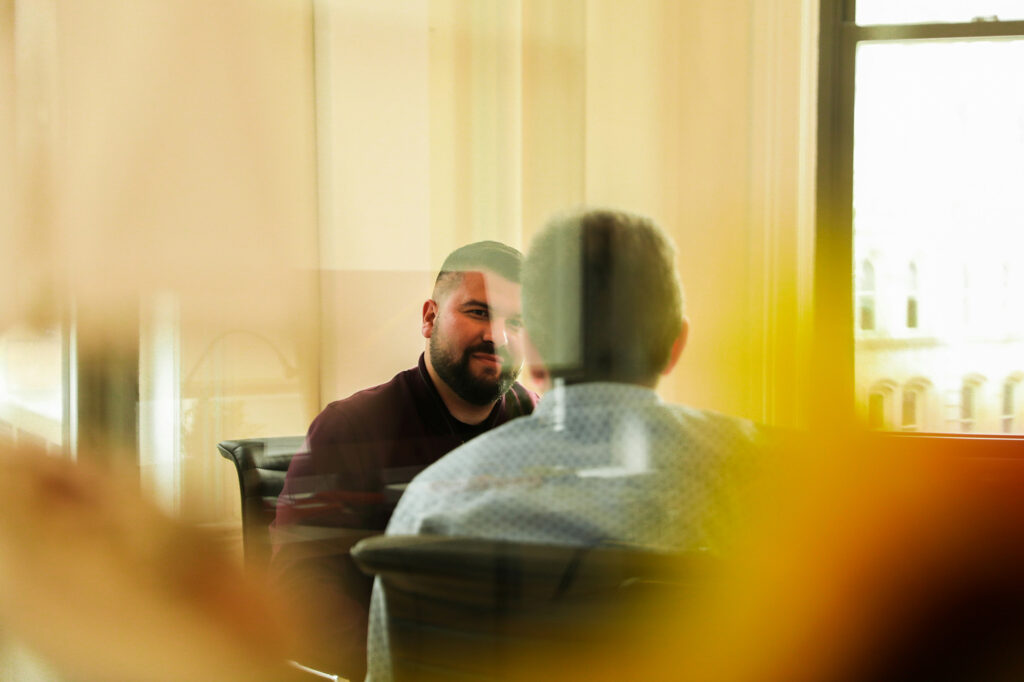 Two employees discussing risk and compliance related concerns