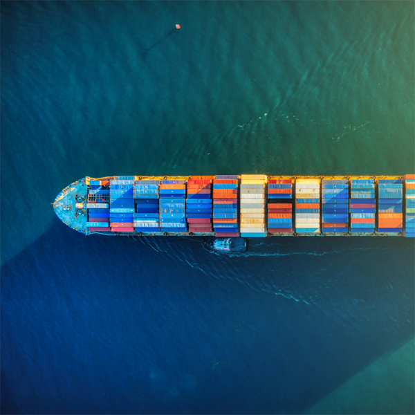 a ship filled with containers being part of larger supply chain